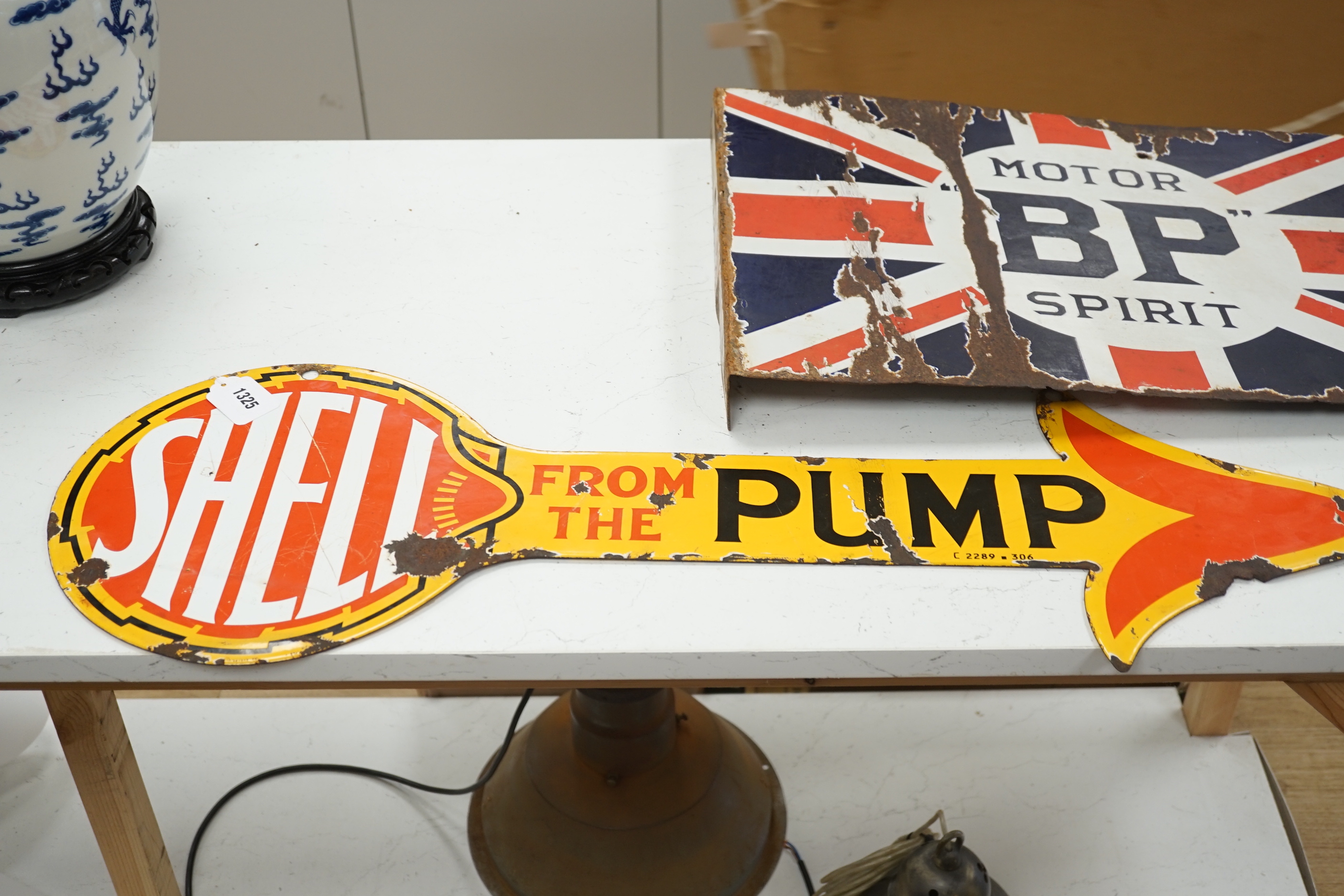 Three enamel advertising signs including BP Motor Spirit and Sphinx Plugs, largest 61cm wide